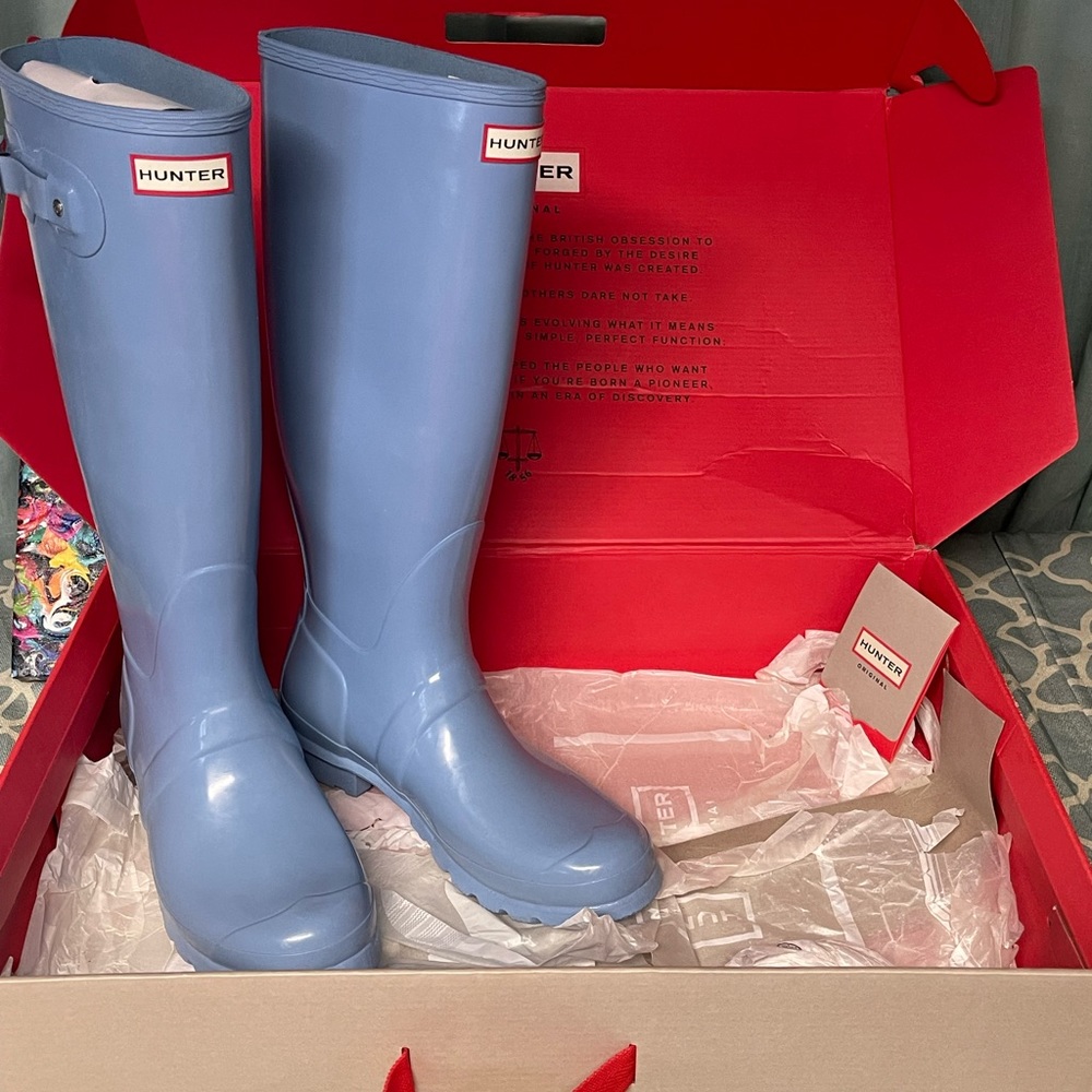 Tall shiny Hunter Rain Boots. Perfect condition. Never worn.
